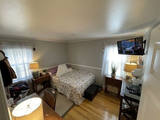 12 Hendricks Street Avon, MA 02322 - Photo 13 of 19 a bedroom with furniture and a flat screen tv