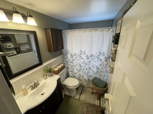 12 Hendricks Street Avon, MA 02322 - Photo 14 of 19 a bathroom with a sink a toilet and shower curtain