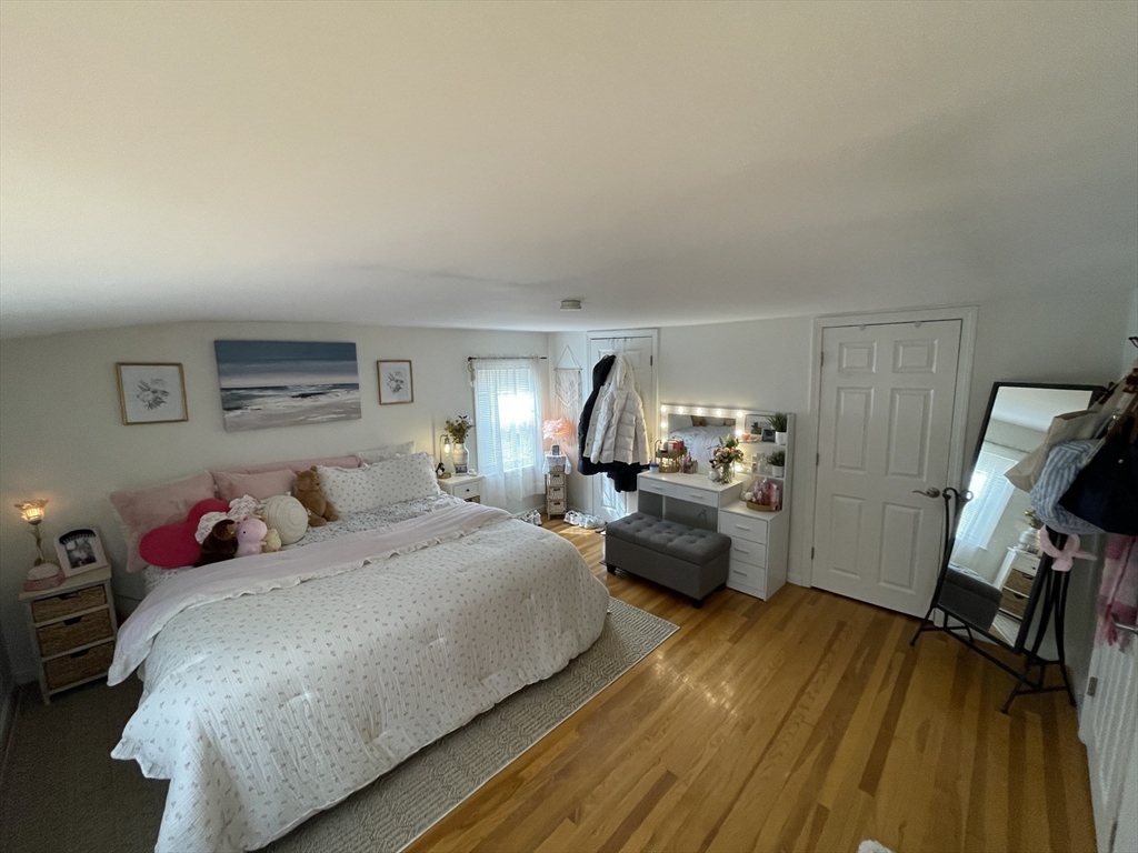 12 Hendricks Street Avon, MA 02322 - Photo 17 of 19 a bedroom with furniture and a wooden floor