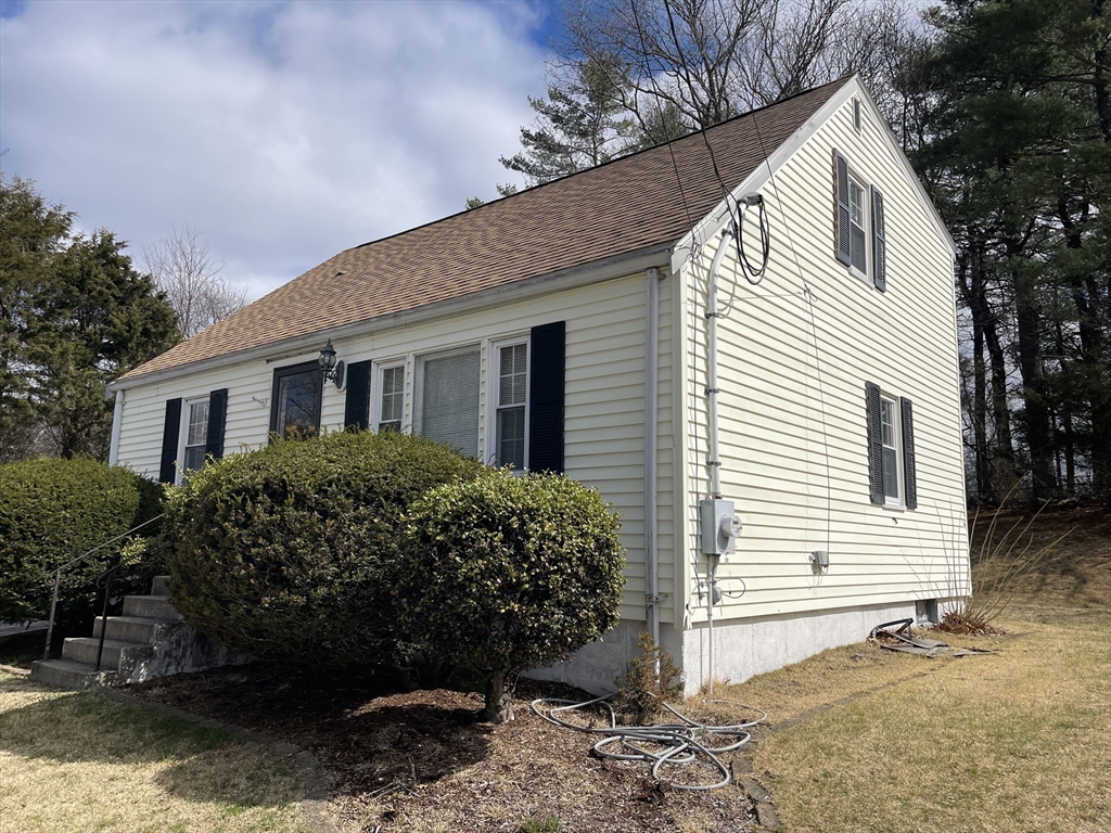12 Hendricks Street Avon, MA 02322 - Photo 2 of 19 a front view of a house with a garden