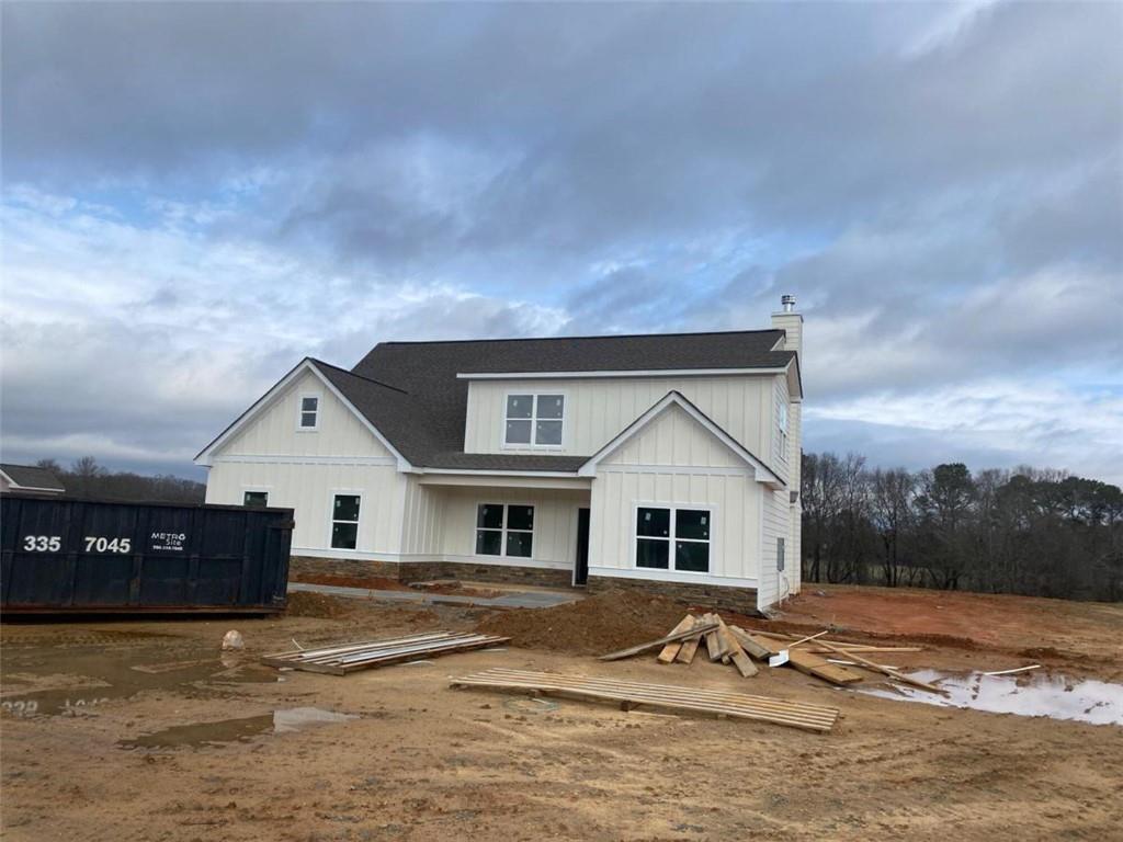 1711 Michael Road Northwest Monroe, GA 30656 - Photo 1 of 1 a view of white house with a big yard and large trees