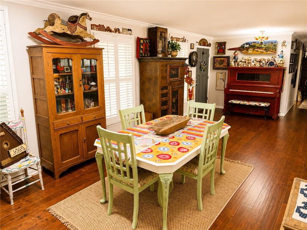 225 Pineridge Road Bogart, GA 30622 - Photo 38 of 53 a view of a dining room with furniture and wooden floor