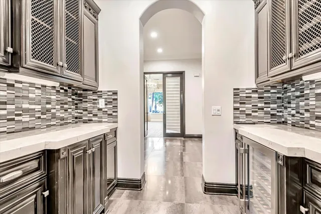 a kitchen with granite countertop a sink and a stove