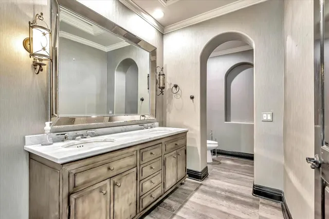 a bathroom with a granite countertop sink a large mirror and a shower