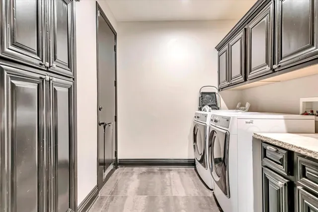 a view of a kitchen with washer and dryer