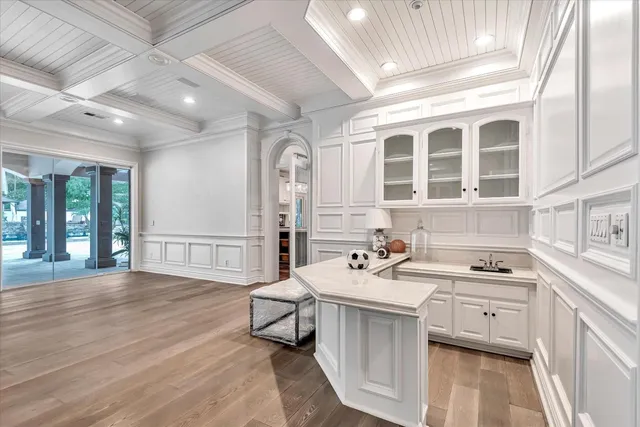 a kitchen with a sink stove and cabinets
