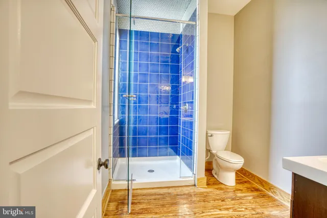 a bathroom with a toilet and shower