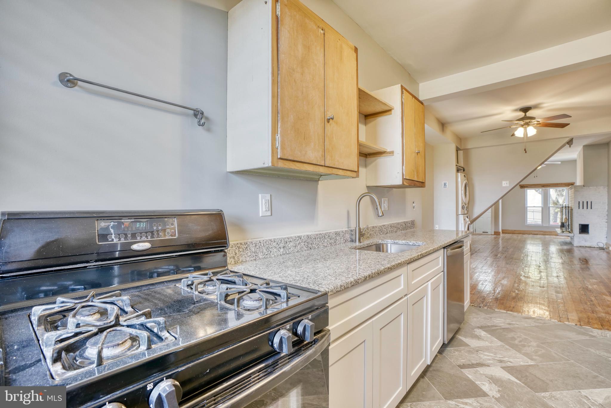 343 East 21st Street Baltimore, MD 21218 - Photo 9 of 22 a kitchen with a stove and a sink