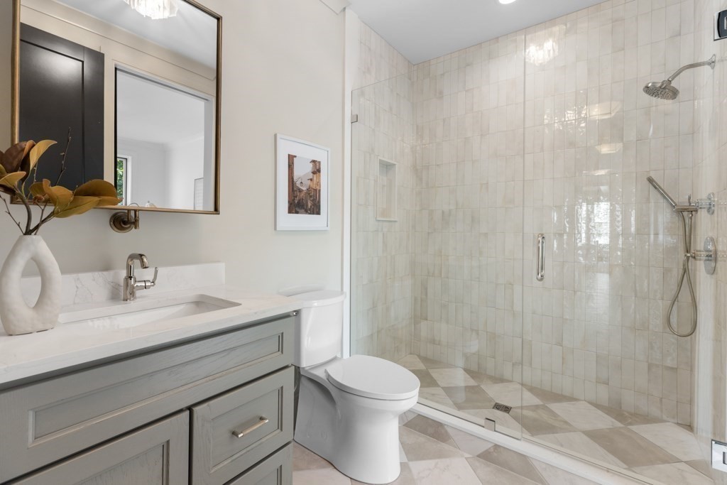 107 Valley Road Needham, MA 02492 - Photo 14 of 36 a bathroom with a sink a toilet and shower