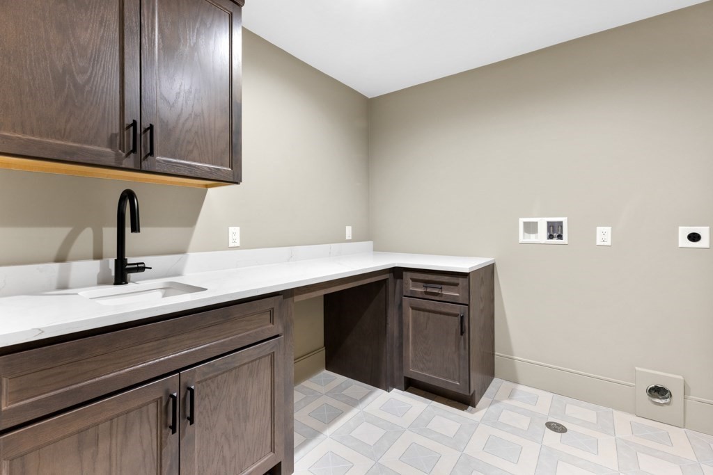 107 Valley Road Needham, MA 02492 - Photo 15 of 36 a kitchen with a sink and cabinets