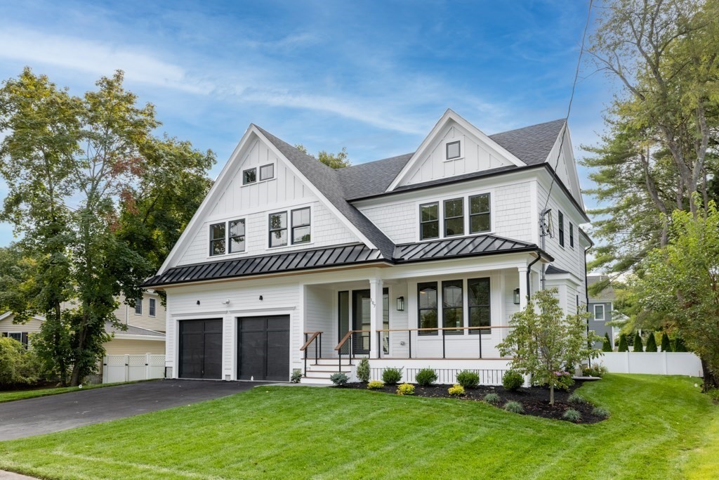 107 Valley Road Needham, MA 02492 - Photo 2 of 36 a front view of a house with a yard and porch