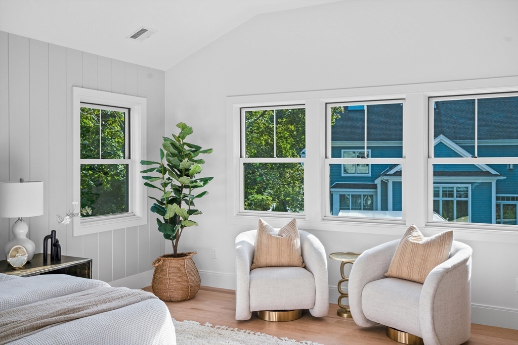 107 Valley Road Needham, MA 02492 - Photo 23 of 36 a living room with furniture and a potted plant
