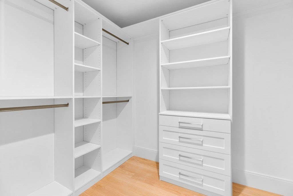 107 Valley Road Needham, MA 02492 - Photo 24 of 36 a view of walk in closet with empty racks
