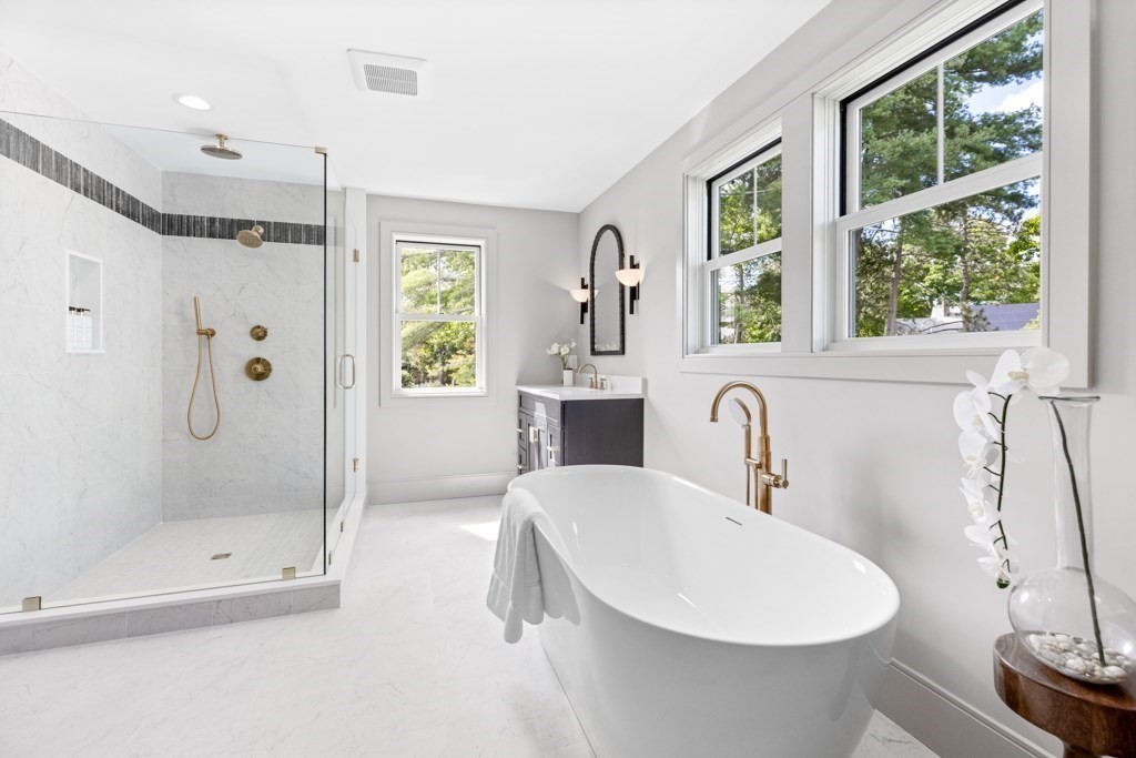 107 Valley Road Needham, MA 02492 - Photo 27 of 36 a bathroom with a sink and a mirror