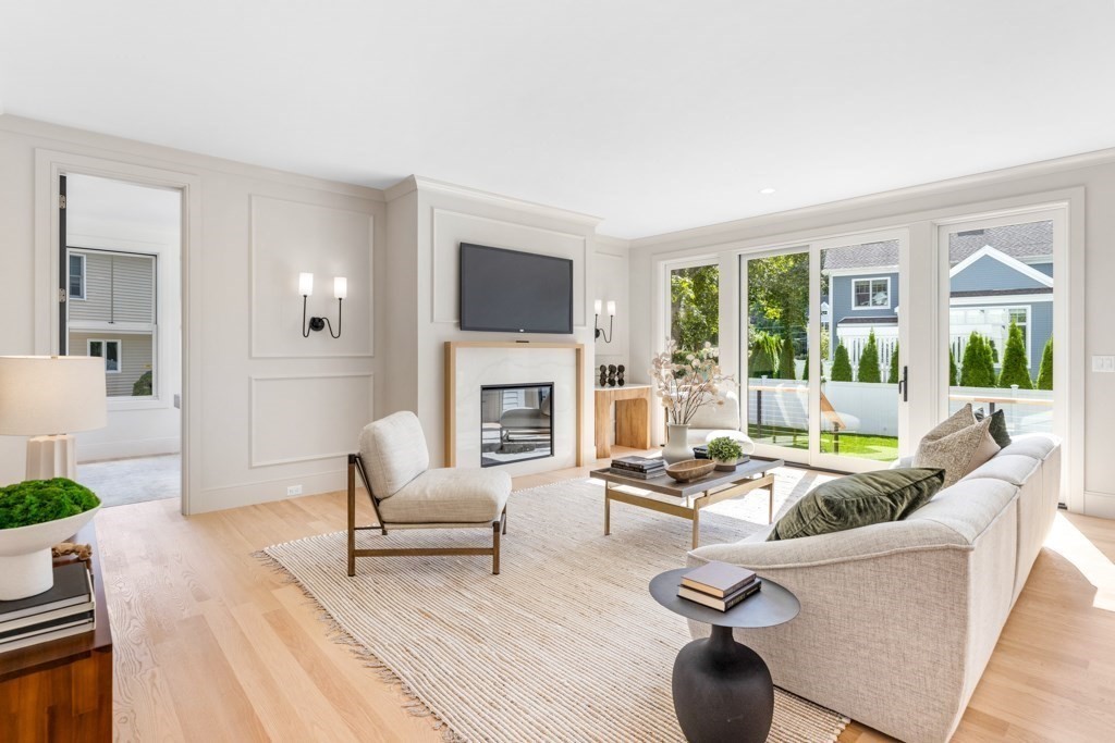 107 Valley Road Needham, MA 02492 - Photo 33 of 36 a living room with fireplace furniture and a large window