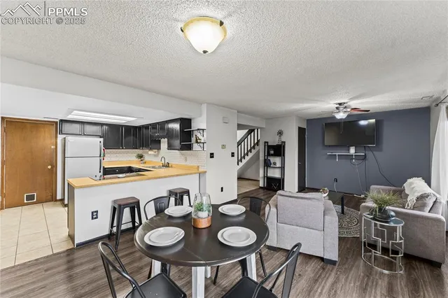 a kitchen with a dining table and chairs