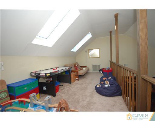 196 Friendship Road Cranbury, NJ 08512 - Photo 15 of 25 a bedroom with furniture and a wooden floor