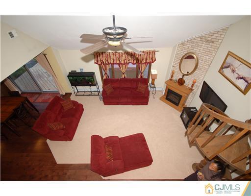 196 Friendship Road Cranbury, NJ 08512 - Photo 18 of 25 a living room with furniture and a view of kitchen