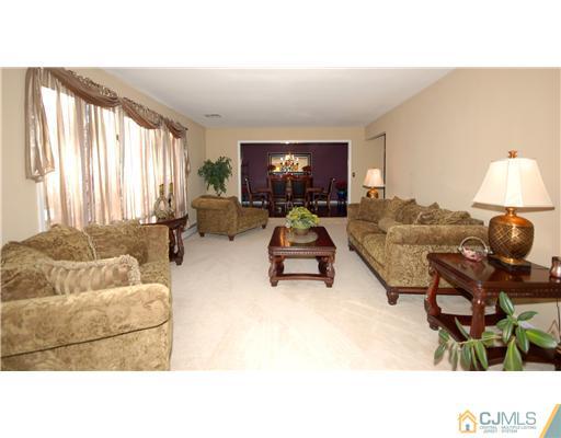 196 Friendship Road Cranbury, NJ 08512 - Photo 3 of 25 a living room with furniture and a flat screen tv