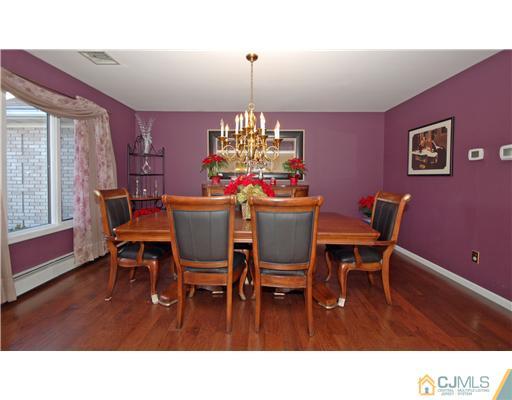 196 Friendship Road Cranbury, NJ 08512 - Photo 4 of 25 a dining room with furniture a chandelier and window