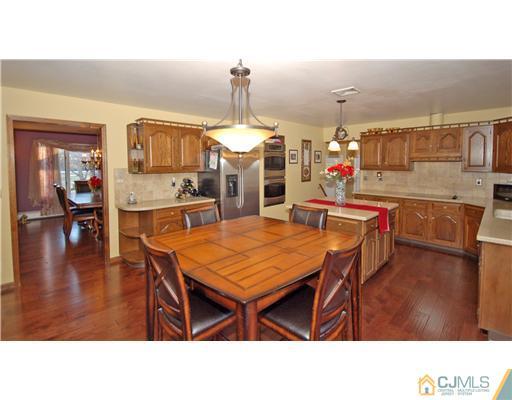 196 Friendship Road Cranbury, NJ 08512 - Photo 5 of 25 a living room with dining table and chairs
