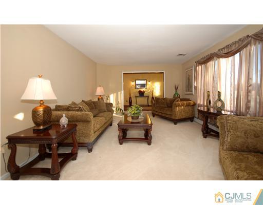 196 Friendship Road Cranbury, NJ 08512 - Photo 7 of 25 a living room with furniture and a large window