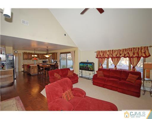 196 Friendship Road Cranbury, NJ 08512 - Photo 8 of 25 a living room with furniture and a large window