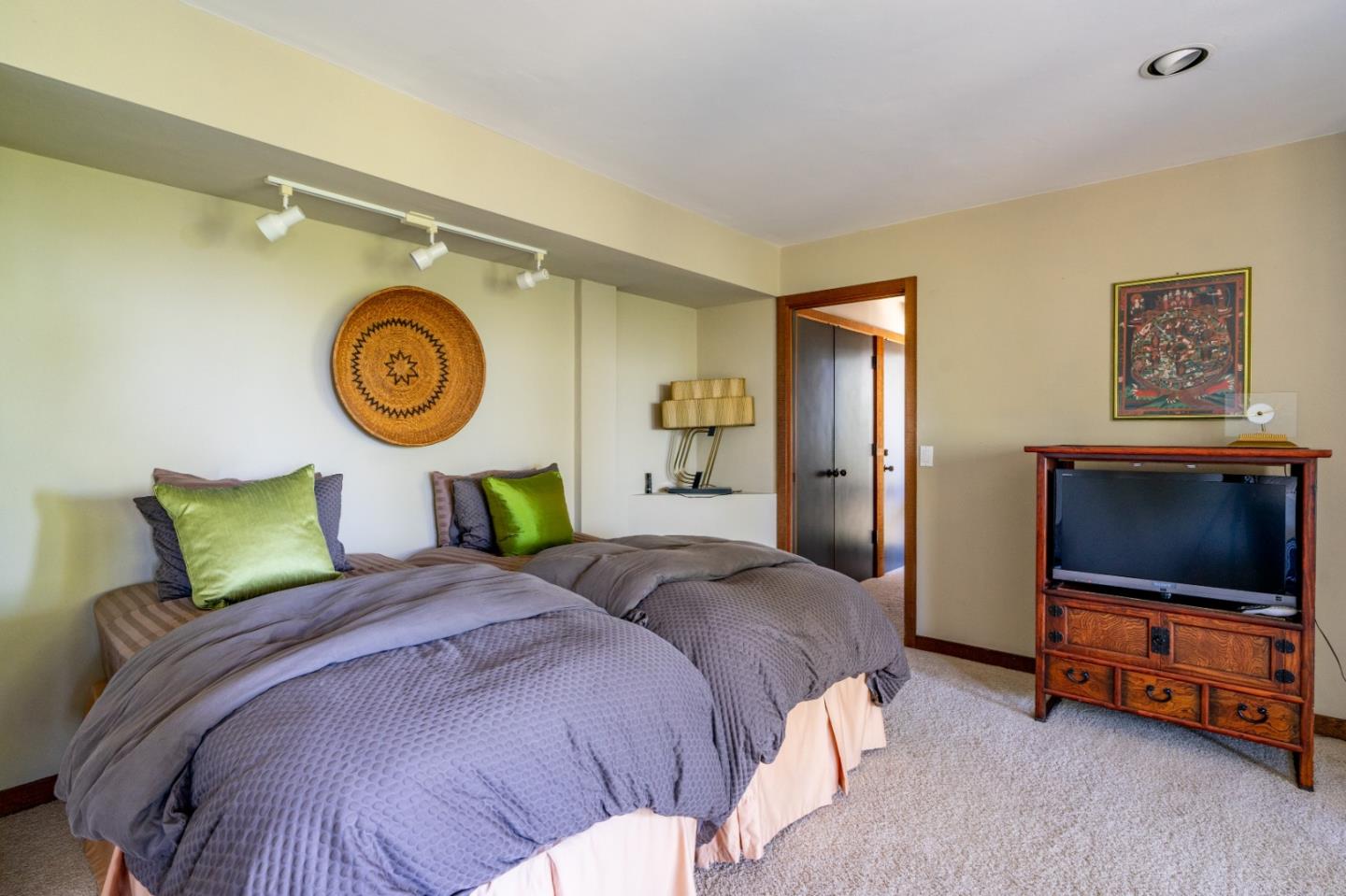 211 Crest Road Carmel, CA 93923 - Photo 13 of 21 a bedroom with a bed and a flat screen tv