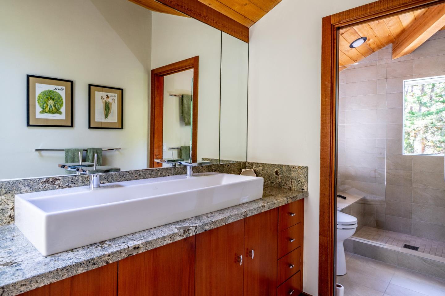 211 Crest Road Carmel, CA 93923 - Photo 6 of 21 a bathroom with a granite countertop sink and a mirror