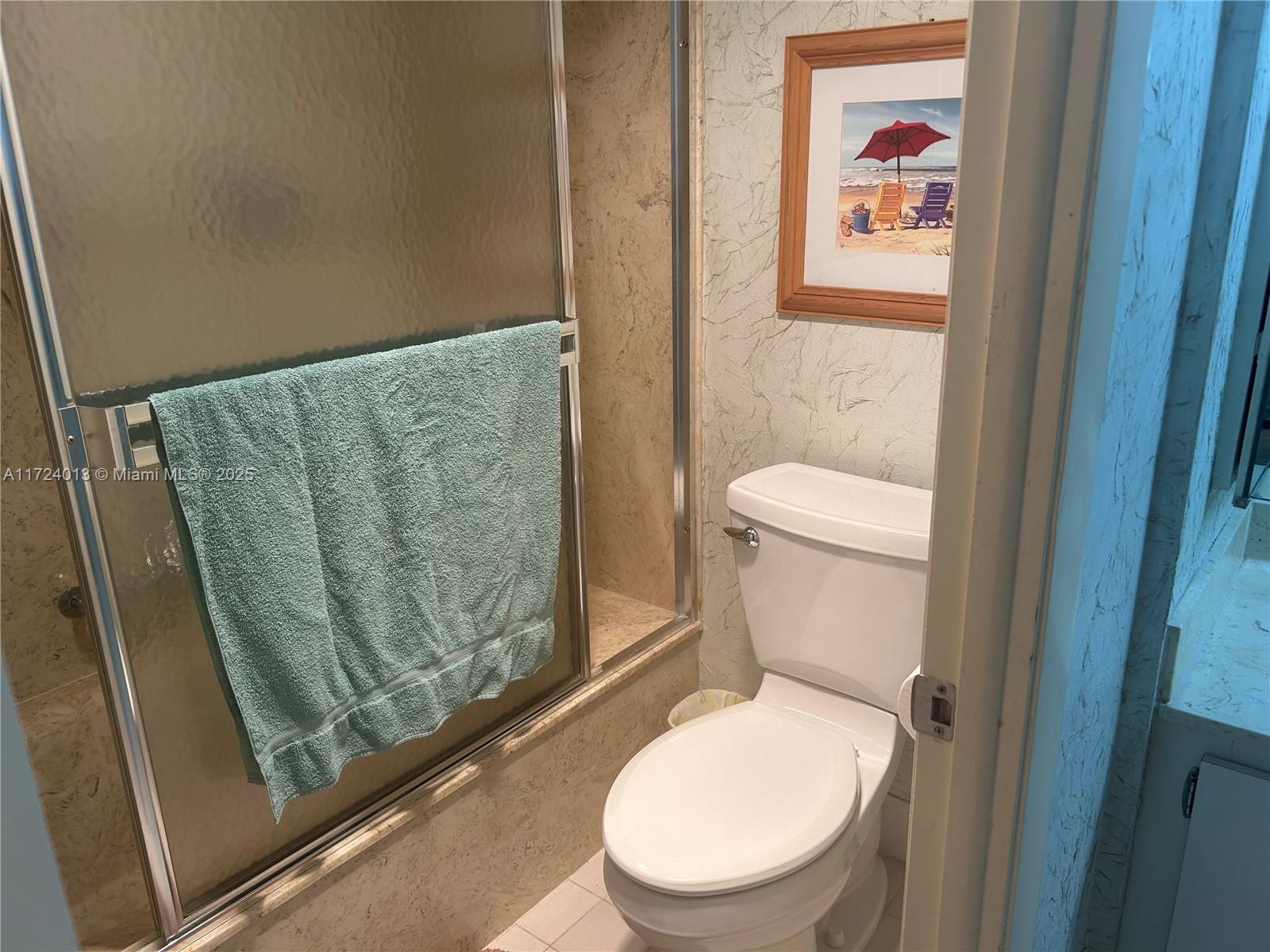2802 North 46th Avenue, Unit B319 Hollywood, FL 33021 - Photo 21 of 40 a white toilet sitting next to a small bathroom