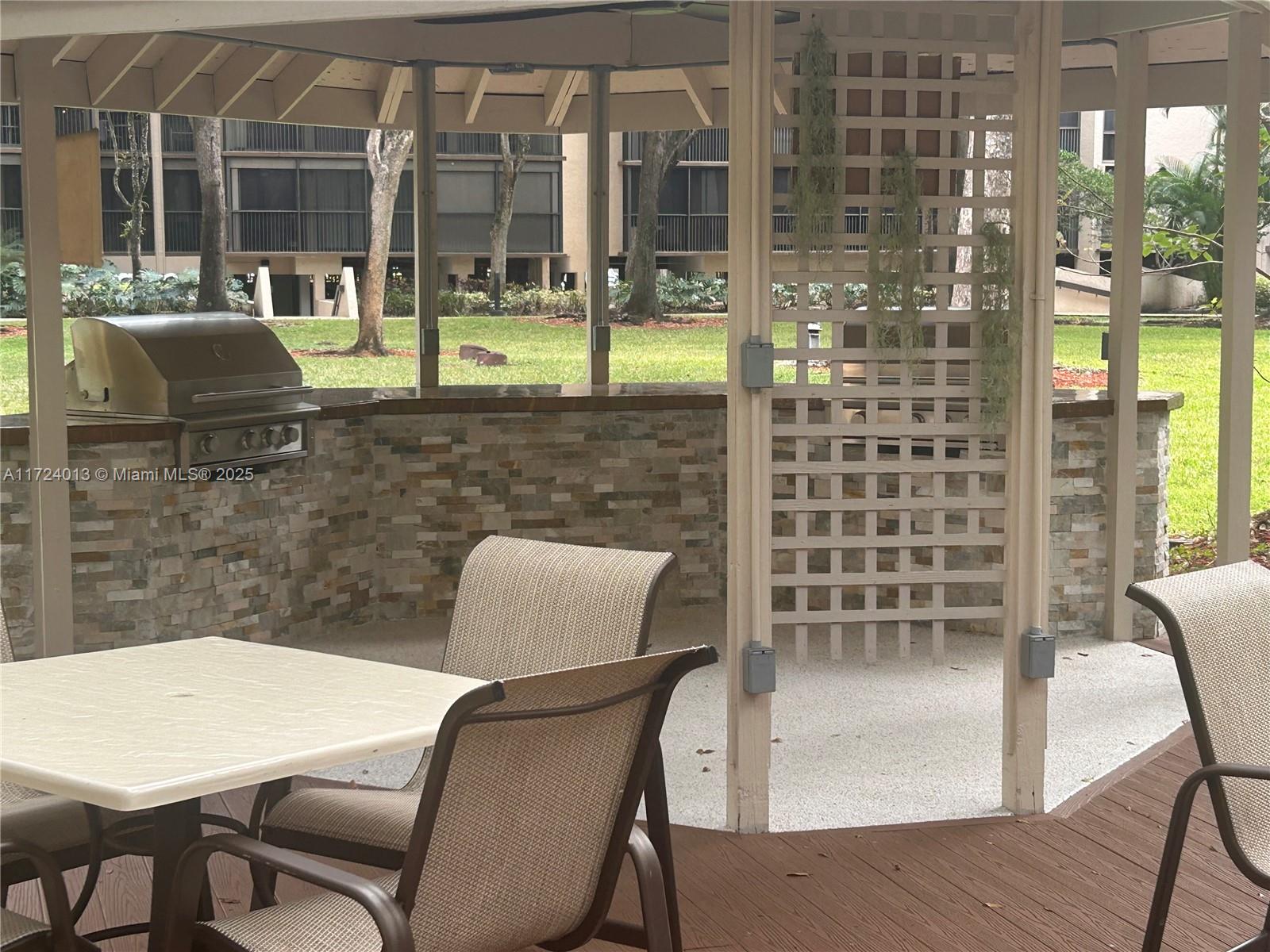 2802 North 46th Avenue, Unit B319 Hollywood, FL 33021 - Photo 28 of 40 a dining room with furniture and window