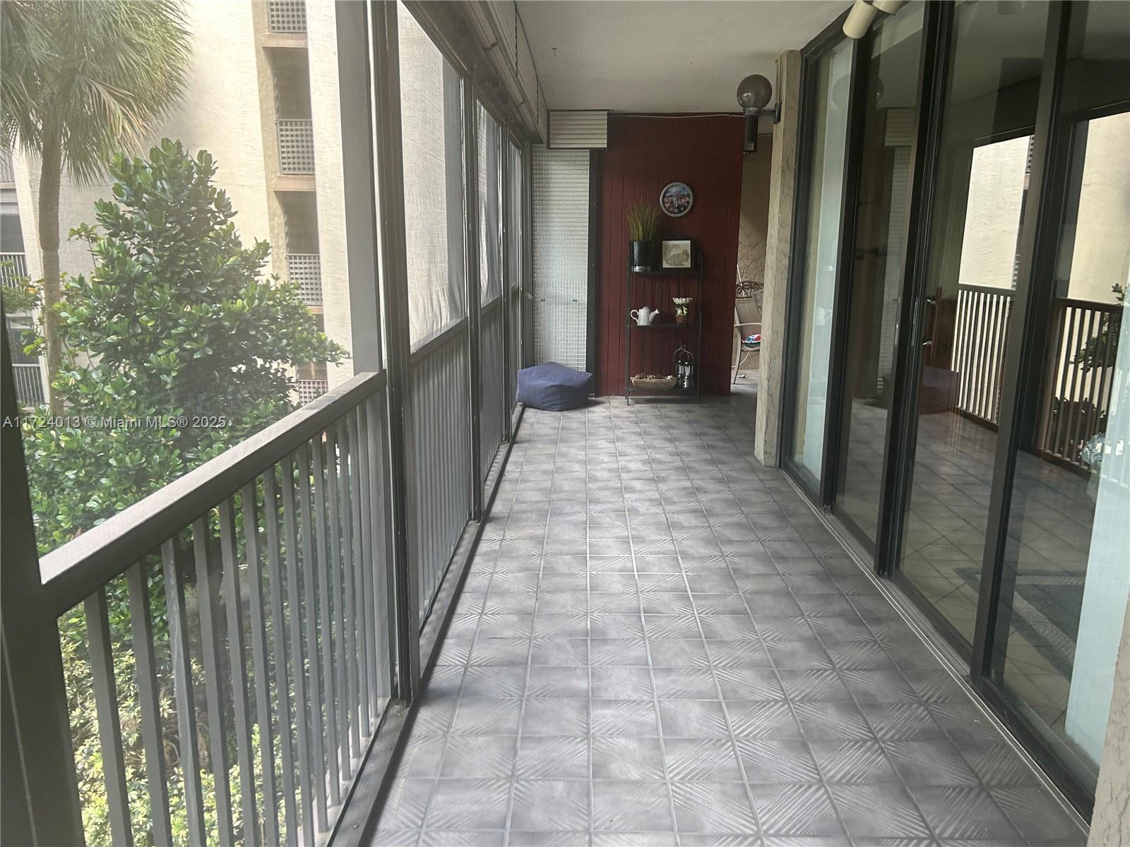 2802 North 46th Avenue, Unit B319 Hollywood, FL 33021 - Photo 3 of 40 a view of a balcony with wooden floor