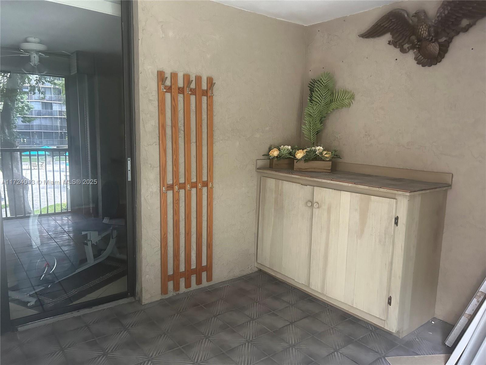 2802 North 46th Avenue, Unit B319 Hollywood, FL 33021 - Photo 5 of 40 a view of a hallway with closet area