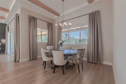 a kitchen with stainless steel appliances a sink a refrigerator and cabinets