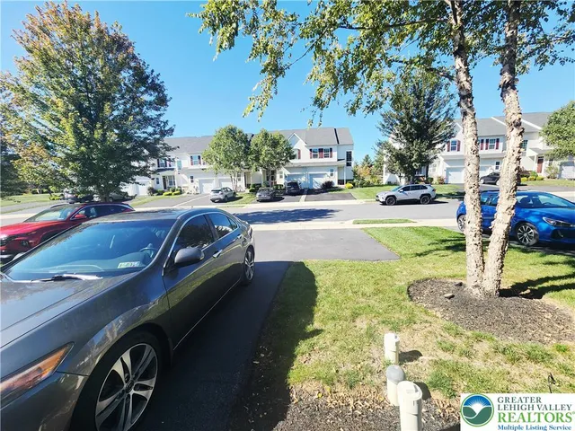a view of a street with cars