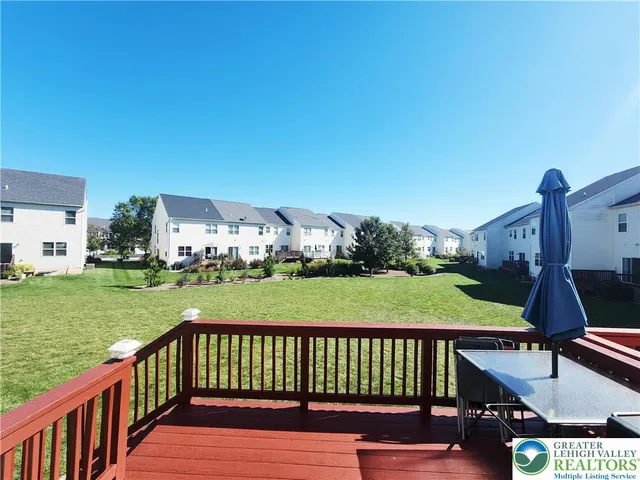 a view of a balcony with two chairs