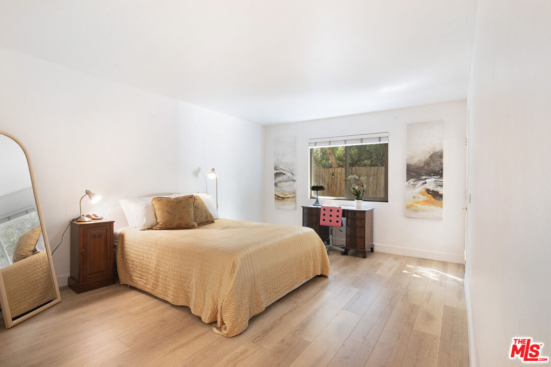 6479 Kanan Dume Road, Unit 24 Malibu, CA 90265 - Photo 12 of 22 a bedroom with a large bed and a window