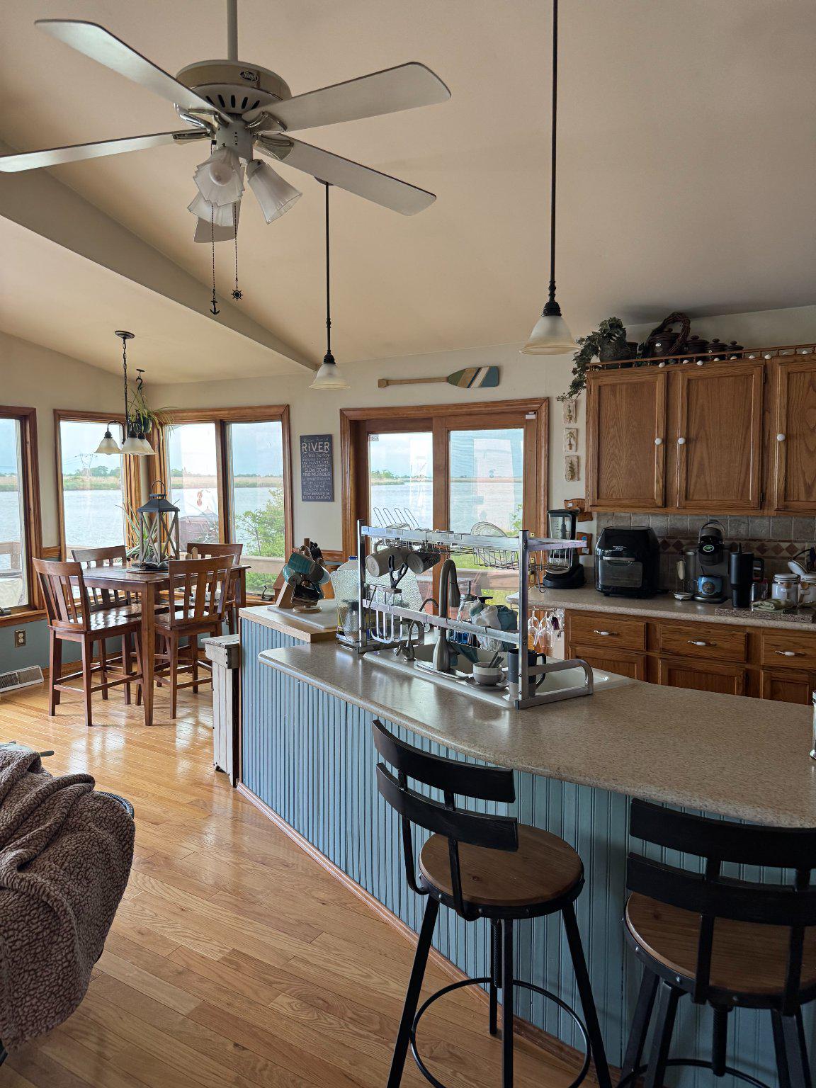 74 Sinnickson Landing Road Salem, NJ 08079 - Photo 13 of 51 a kitchen with a table chairs stove and cabinets