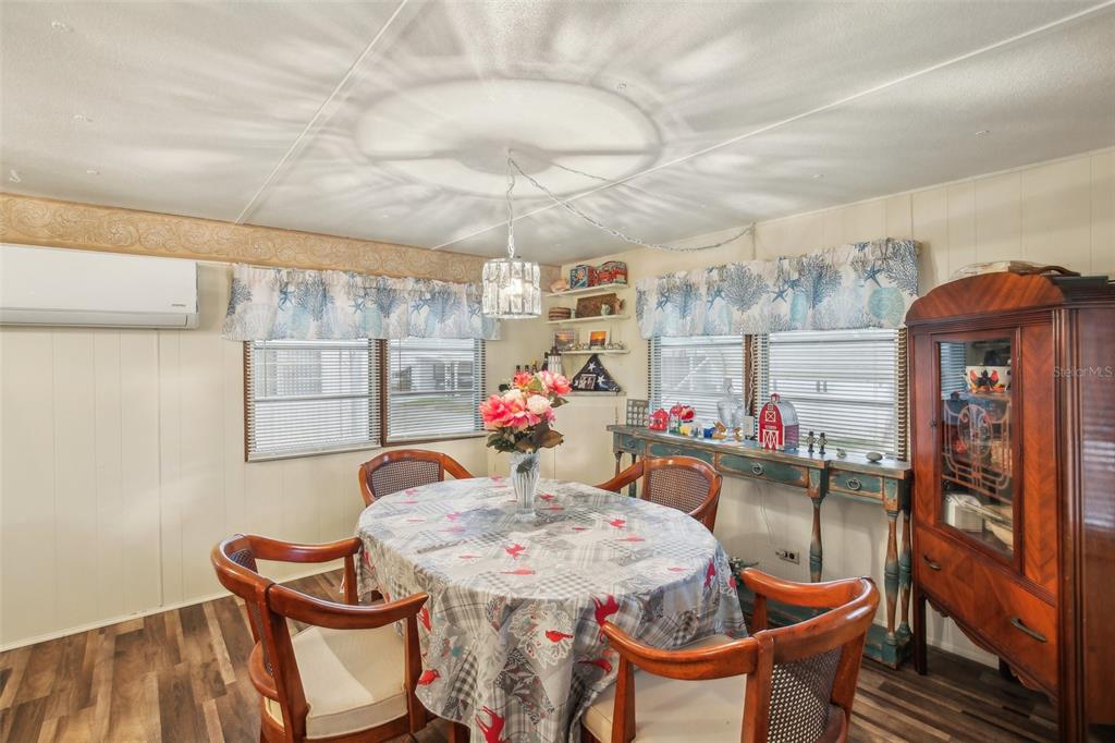 1600 Old Coachman Rd., Unit 311 Clearwater, FL 33765 - Photo 11 of 27 a dining room with furniture and window