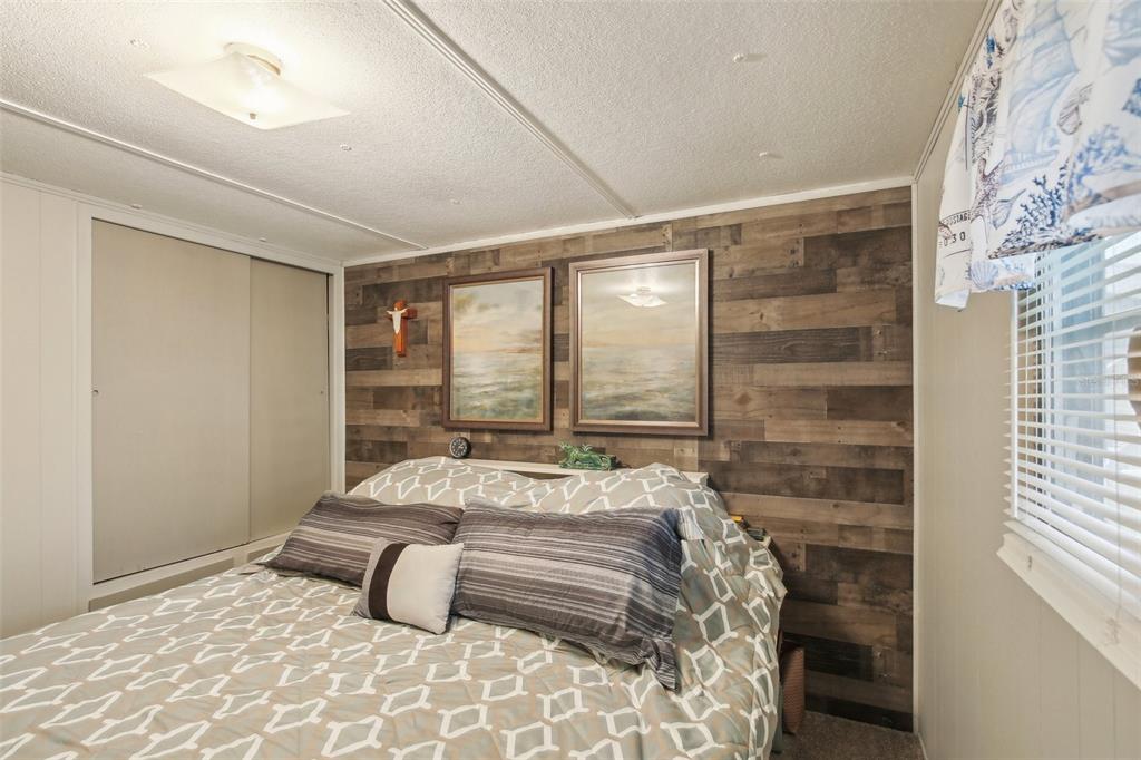 1600 Old Coachman Rd., Unit 311 Clearwater, FL 33765 - Photo 16 of 27 a bedroom with a bed and a window