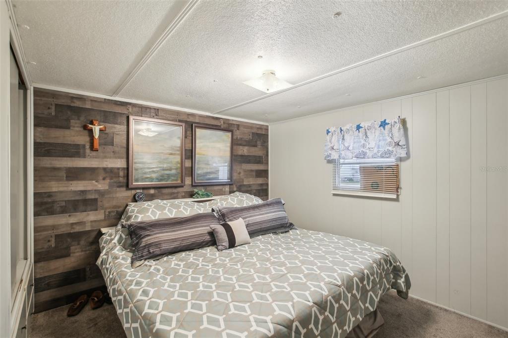 1600 Old Coachman Rd., Unit 311 Clearwater, FL 33765 - Photo 18 of 27 a bedroom with a large bed and a window