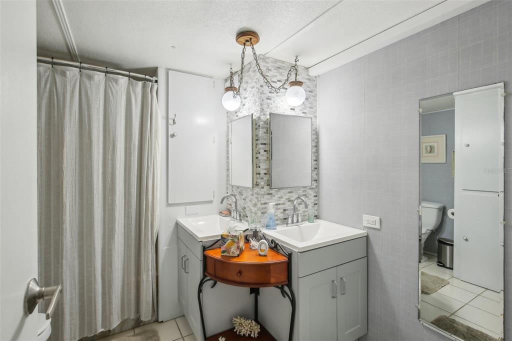 1600 Old Coachman Rd., Unit 311 Clearwater, FL 33765 - Photo 19 of 27 a dining room with furniture and chandelier