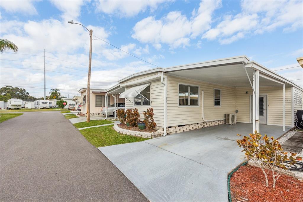 1600 Old Coachman Rd., Unit 311 Clearwater, FL 33765 - Photo 2 of 27 a view of a house with a backyard