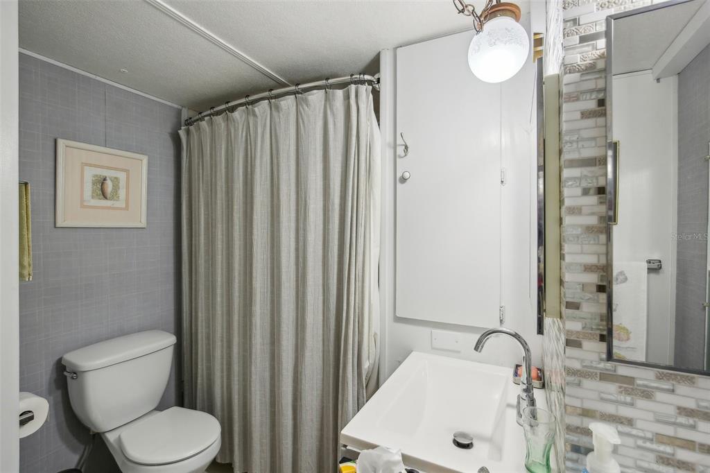 1600 Old Coachman Rd., Unit 311 Clearwater, FL 33765 - Photo 21 of 27 a bathroom with a sink and toilet