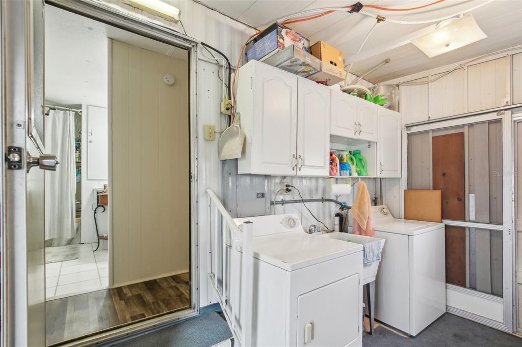 1600 Old Coachman Rd., Unit 311 Clearwater, FL 33765 - Photo 26 of 27 a view of kitchen with furniture and wooden floor