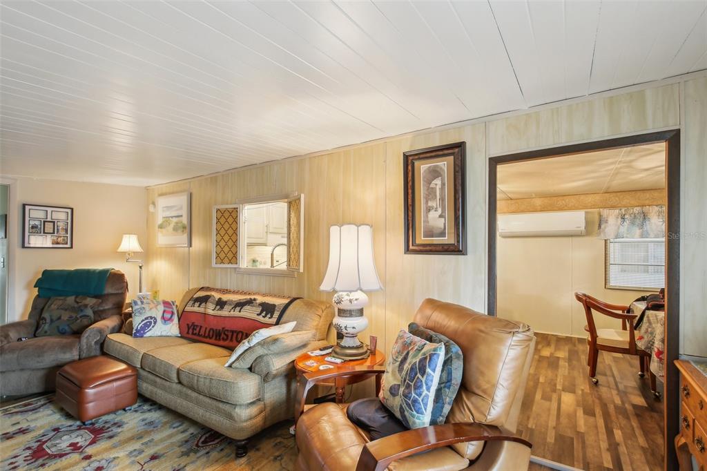 1600 Old Coachman Rd., Unit 311 Clearwater, FL 33765 - Photo 8 of 27 a living room with furniture and a window