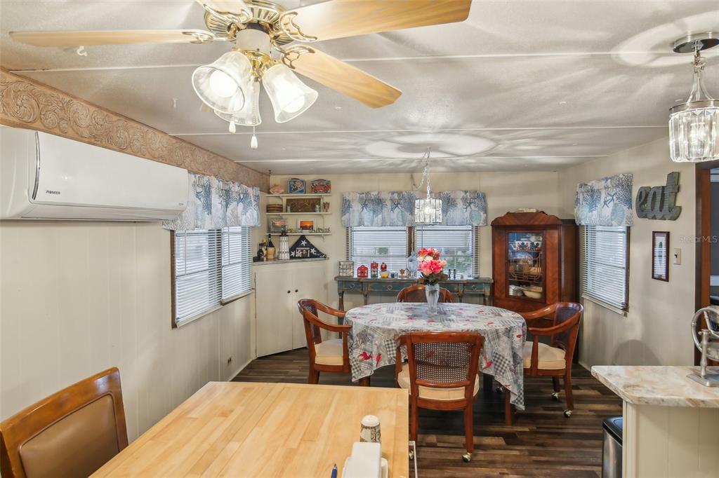 1600 Old Coachman Rd., Unit 311 Clearwater, FL 33765 - Photo 10 of 27 a dining room with furniture and window