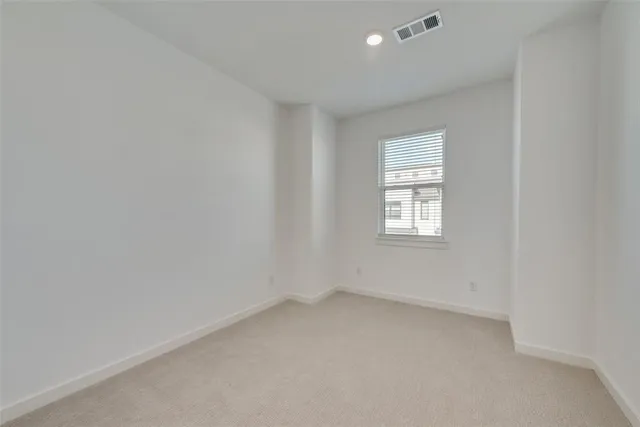 an aerial view of a golf course with a lake view