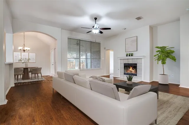 a living room with furniture and a fireplace