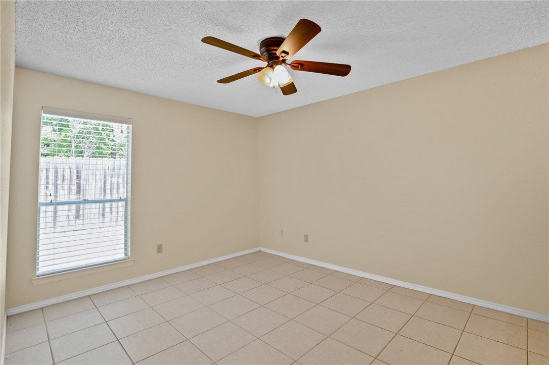 12213 Tyson Cove, Unit B Austin, TX 78758 - Photo 9 of 15 a view of an empty room with a window